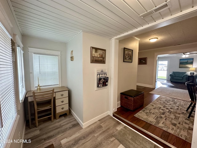 1118 W Main St, Belhaven, NC 27810 - hallway with wood finished floors, baseboards, and a desk