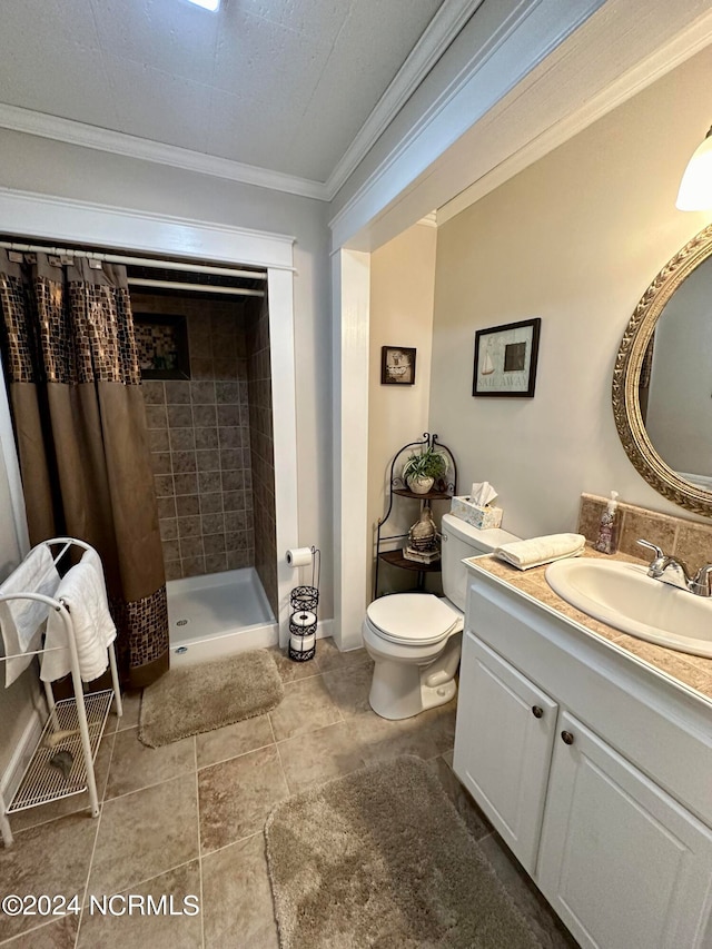 bathroom with ornamental molding, toilet, vanity, and curtained shower