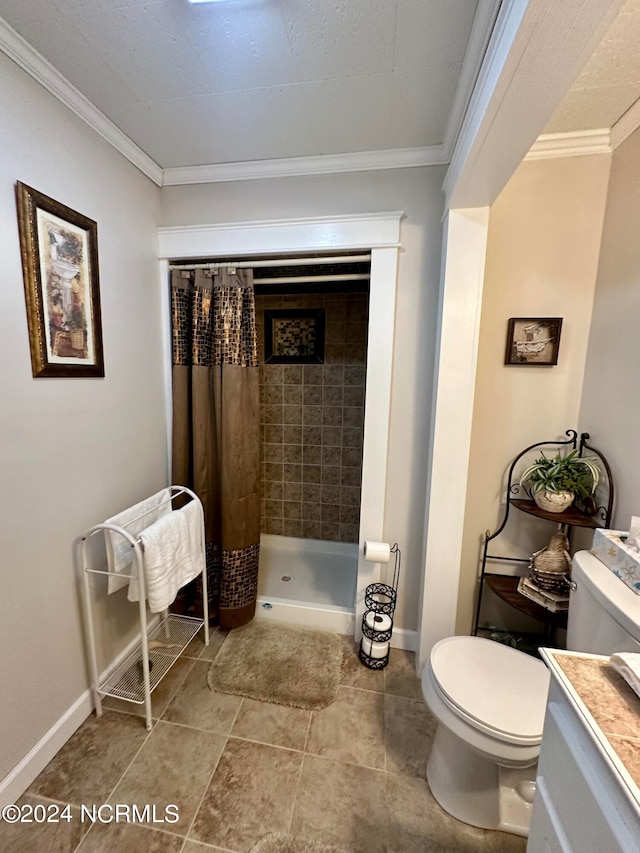 bathroom with vanity, crown molding, toilet, and curtained shower