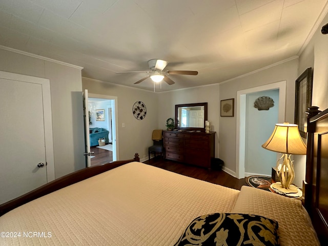 bedroom featuring ceiling fan, ornamental molding, and dark wood-type flooring