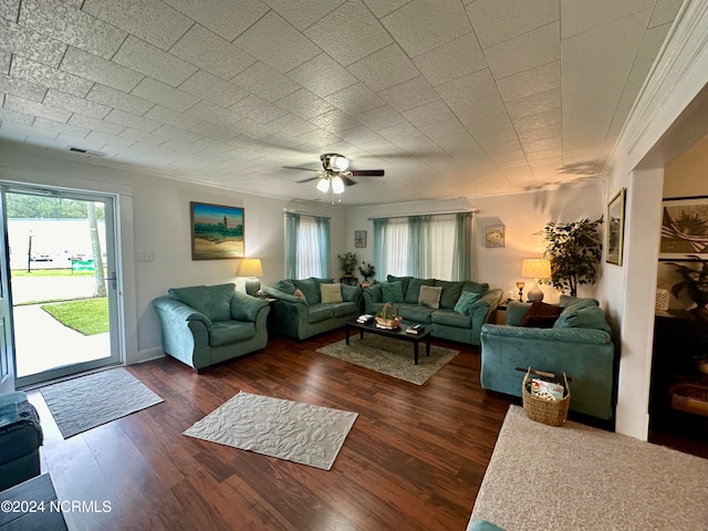 living room with ceiling fan and dark wood-type flooring