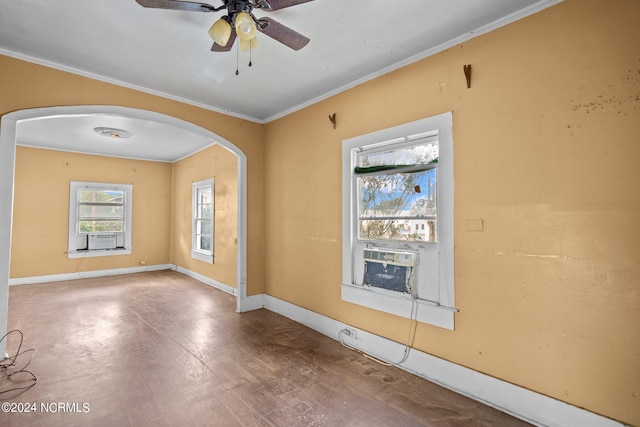 empty room with ornamental molding, cooling unit, and ceiling fan