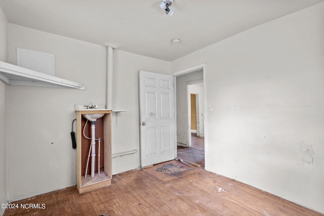 unfurnished bedroom with wood-type flooring