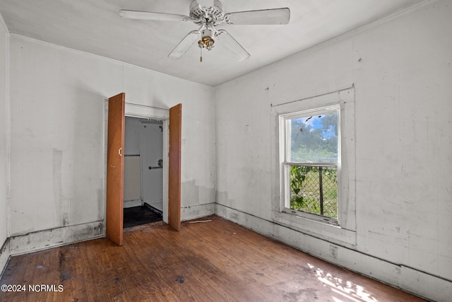 unfurnished room featuring ceiling fan and dark hardwood / wood-style floors