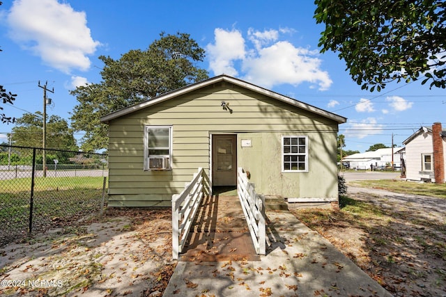 bungalow-style home featuring cooling unit