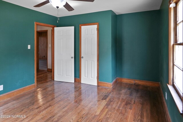 unfurnished bedroom with hardwood / wood-style floors and ceiling fan