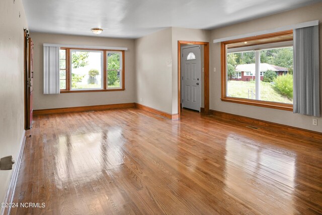 spare room with light wood-type flooring