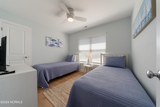 bedroom featuring ceiling fan and hardwood / wood-style flooring