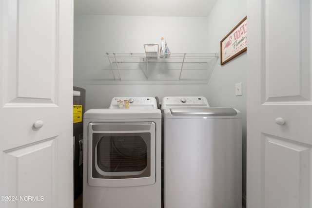 washroom featuring washer and clothes dryer