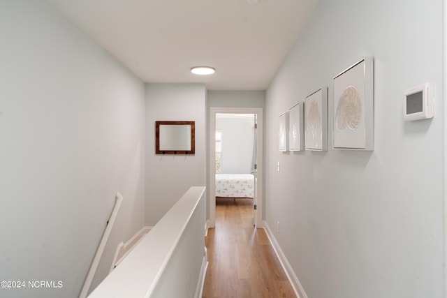 corridor with light wood-type flooring