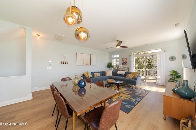 dining room with ceiling fan and light hardwood / wood-style flooring