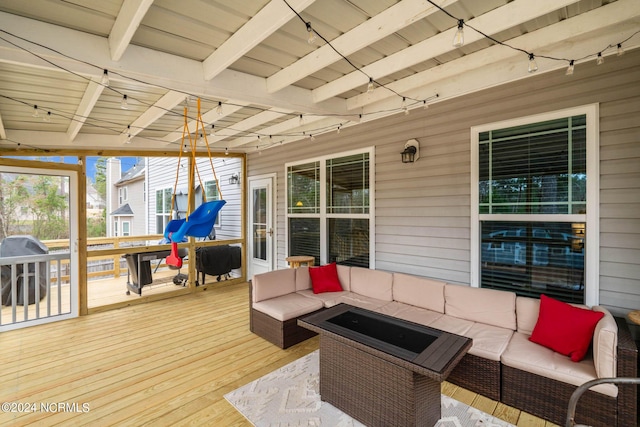 wooden terrace featuring grilling area and outdoor lounge area