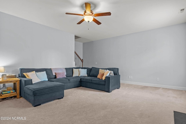 carpeted living room featuring ceiling fan