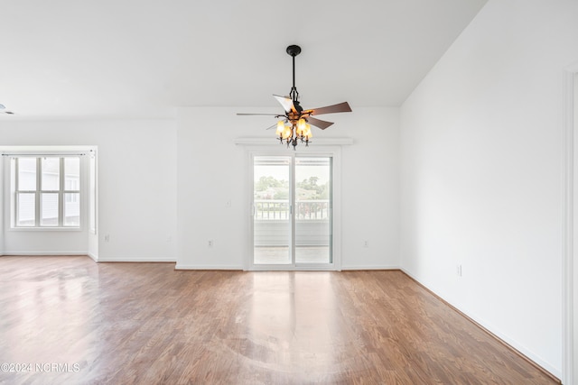 spare room featuring ceiling fan and hardwood / wood-style flooring