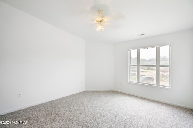 unfurnished room with carpet flooring