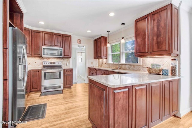 1803 Sedgefield Dr, Kinston, NC 28504 - kitchen featuring ornamental molding, stainless steel appliances, a sink, visible vents, and a peninsula