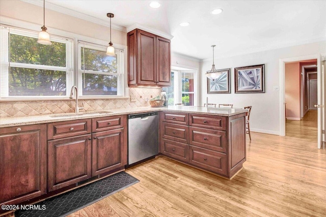 kitchen featuring a wealth of natural light, dishwasher, light hardwood / wood-style floors, and sink