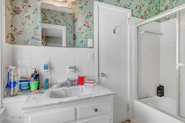 1803 Sedgefield Dr, Kinston, NC 28504 - full bath featuring vanity, tile walls, wallpapered walls, enclosed tub / shower combo, and wainscoting
