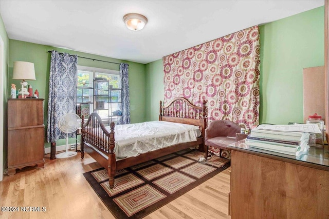 bedroom with light hardwood / wood-style floors