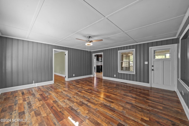 interior space with dark wood-type flooring and ceiling fan