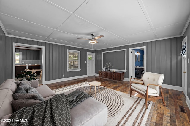 living room with wood-type flooring and ceiling fan