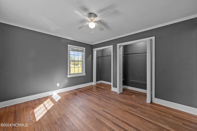 unfurnished bedroom with crown molding, ceiling fan, and wood-type flooring