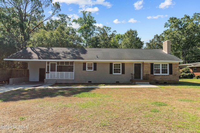 ranch-style home with a front lawn