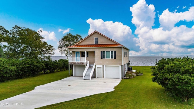 77 Indian Trl, Arapahoe, NC 28510 - beach home with a porch, stairway, a front lawn, and concrete driveway