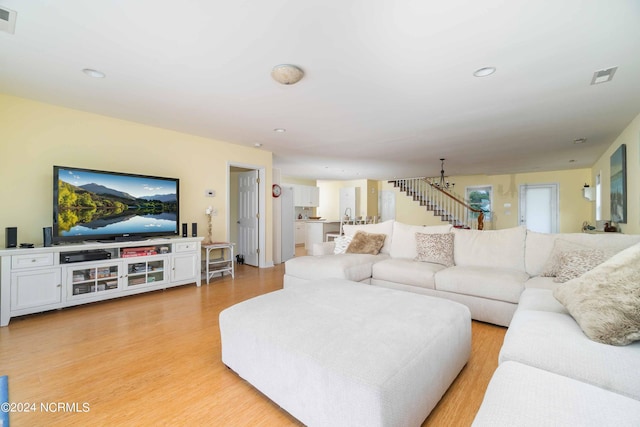 77 Indian Trl, Arapahoe, NC 28510 - living room featuring light wood-type flooring, stairway, and recessed lighting