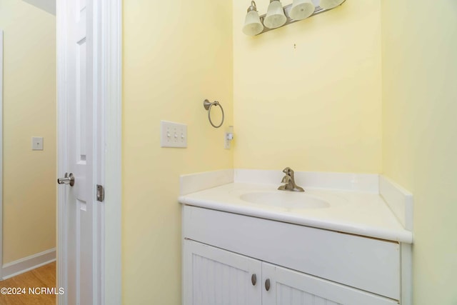 77 Indian Trl, Arapahoe, NC 28510 - bathroom featuring vanity and wood finished floors