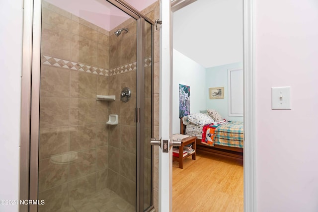 77 Indian Trl, Arapahoe, NC 28510 - ensuite bathroom with a stall shower and wood finished floors
