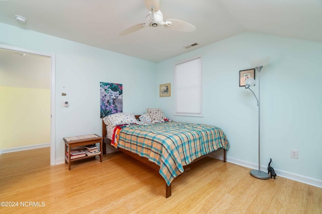 77 Indian Trl, Arapahoe, NC 28510 - bedroom featuring light wood-type flooring, vaulted ceiling, ceiling fan, and baseboards