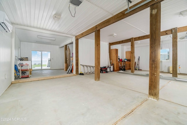 77 Indian Trl, Arapahoe, NC 28510 - garage with a wall unit AC and a garage door opener