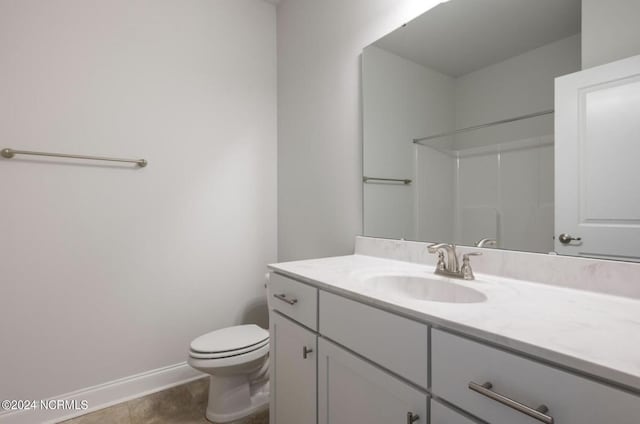 1183 Natal Dr SE, Bolivia, NC 28422 - full bathroom with vanity, tile patterned flooring, toilet, walk in shower, and baseboards