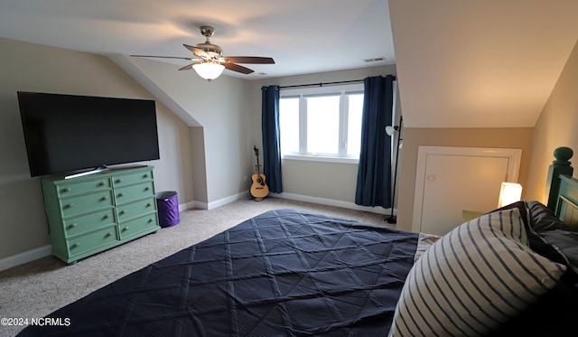 carpeted bedroom featuring ceiling fan and lofted ceiling