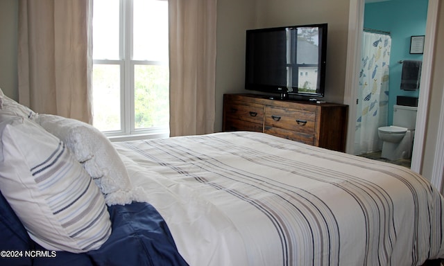 bedroom featuring ensuite bathroom