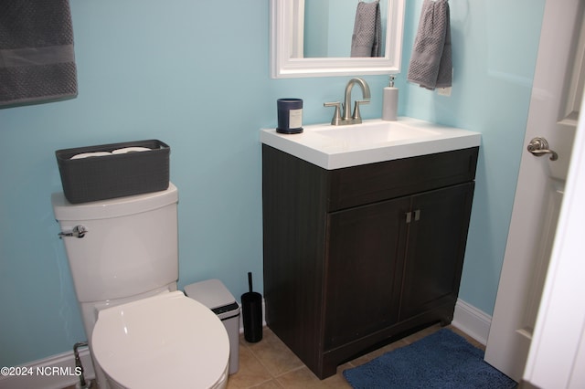 bathroom featuring vanity, toilet, and tile patterned floors