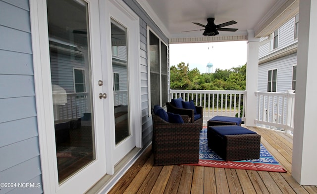 wooden terrace featuring ceiling fan