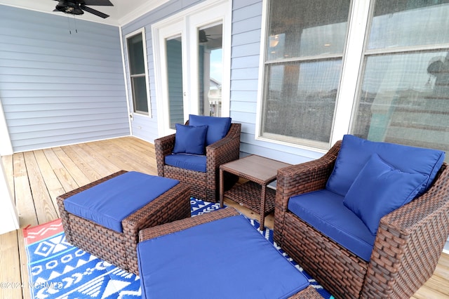 wooden terrace featuring outdoor lounge area and ceiling fan