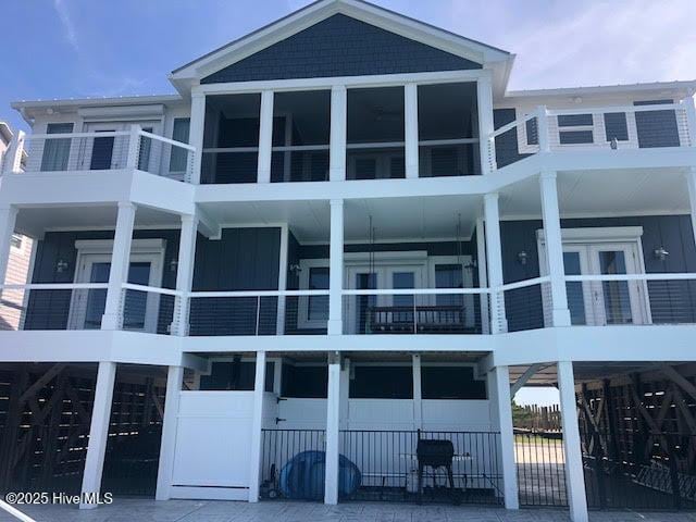 view of building exterior with a garage and decorative driveway