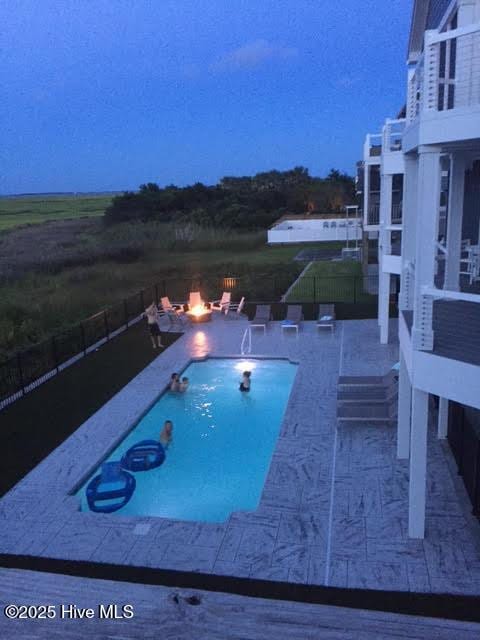 view of pool featuring a patio, fence, and a fenced in pool