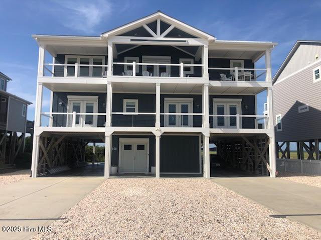 beach home with a carport and concrete driveway