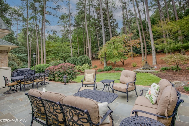 view of patio / terrace featuring outdoor dining space and an outdoor hangout area