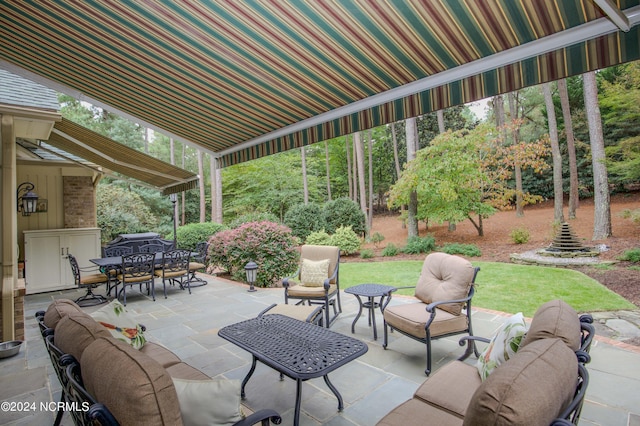 view of patio featuring outdoor dining space and an outdoor living space