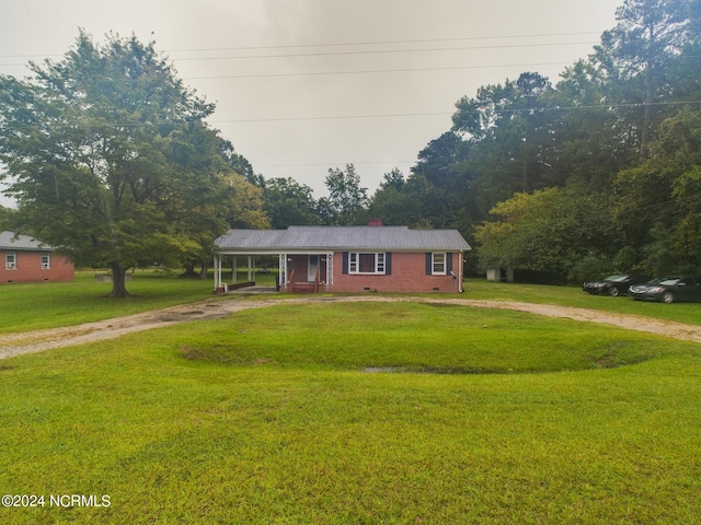 view of front of house with covered porch and a front yard