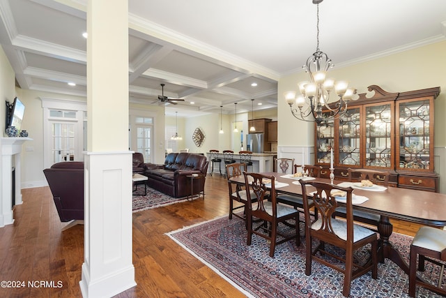 dining room featuring beam ceiling, coffered ceiling, dark hardwood / wood-style floors, ceiling fan with notable chandelier, and ornamental molding