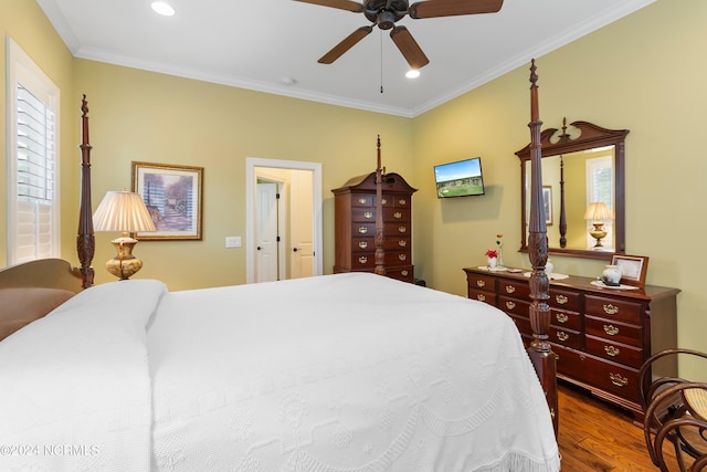 bedroom featuring hardwood / wood-style flooring, ceiling fan, and ornamental molding