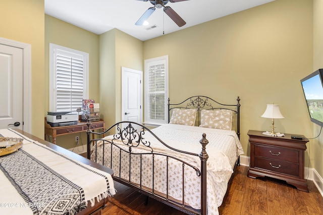 bedroom featuring ceiling fan and dark wood-type flooring