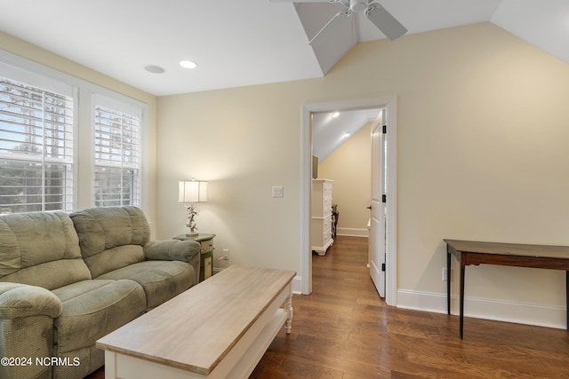 living room featuring ceiling fan and dark hardwood / wood-style flooring