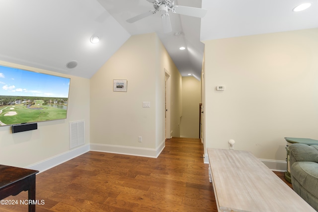 living room with vaulted ceiling, ceiling fan, and dark wood-type flooring